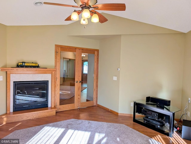 506 6th St SE, Little Falls, MN 56345 - living area featuring vaulted ceiling, wood finished floors, french doors, and ceiling fan