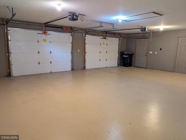 506 6th St SE, Little Falls, MN 56345 - garage featuring a garage door opener