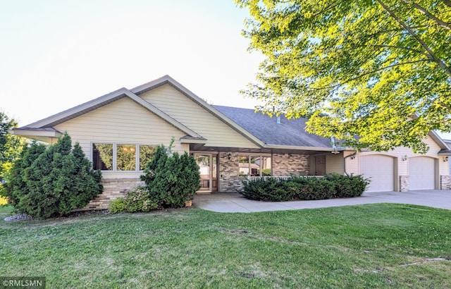506 6th St SE, Little Falls, MN 56345 - single story home with brick siding, a front yard, an attached garage, and concrete driveway