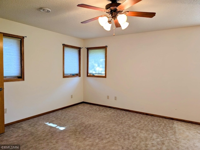 506 6th St SE, Little Falls, MN 56345 - carpeted spare room with a textured ceiling and a ceiling fan