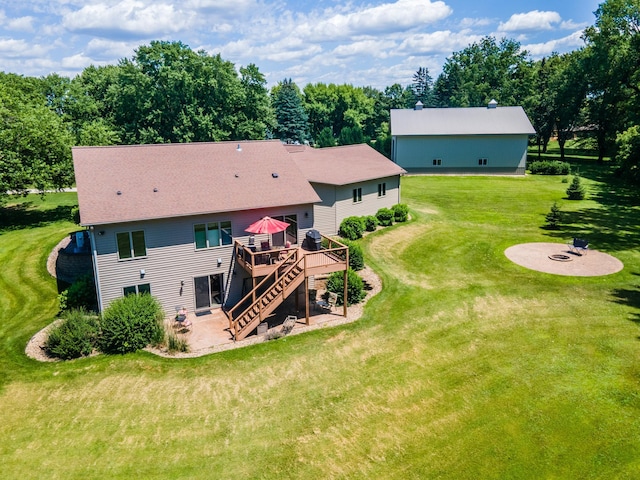 1322 Frontier Rd SE, Salem Twp, MN 55920 - back of property featuring a deck, an outdoor fire pit, a patio, stairs, and a yard