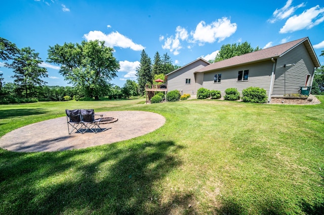 1322 Frontier Rd SE, Salem Twp, MN 55920 - view of green lawn featuring a patio and a deck