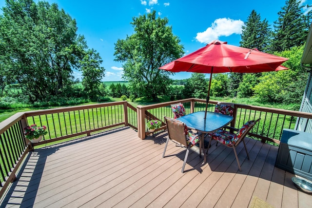 1322 Frontier Rd SE, Salem Twp, MN 55920 - deck with outdoor dining space and a yard