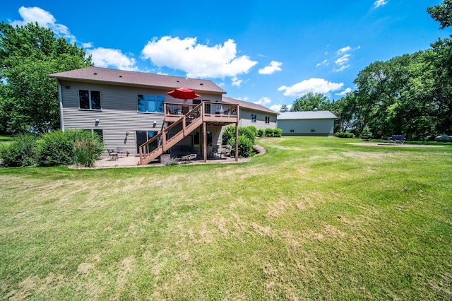 1322 Frontier Rd SE, Salem Twp, MN 55920 - back of property with a wooden deck, stairway, a patio, and a yard