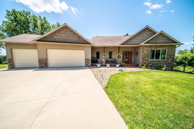1322 Frontier Rd SE, Salem Twp, MN 55920 - craftsman-style house featuring an attached garage, stone siding, a porch, and driveway