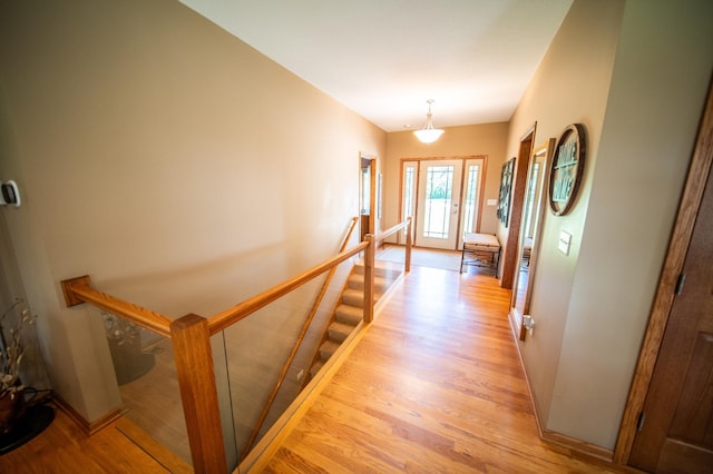 1322 Frontier Rd SE, Salem Twp, MN 55920 - hallway with an upstairs landing and light wood-style floors