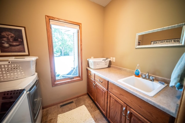 1322 Frontier Rd SE, Salem Twp, MN 55920 - laundry area featuring cabinet space and washer and dryer