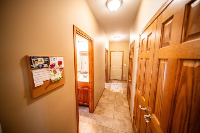 1322 Frontier Rd SE, Salem Twp, MN 55920 - hall featuring light tile patterned flooring and a sink