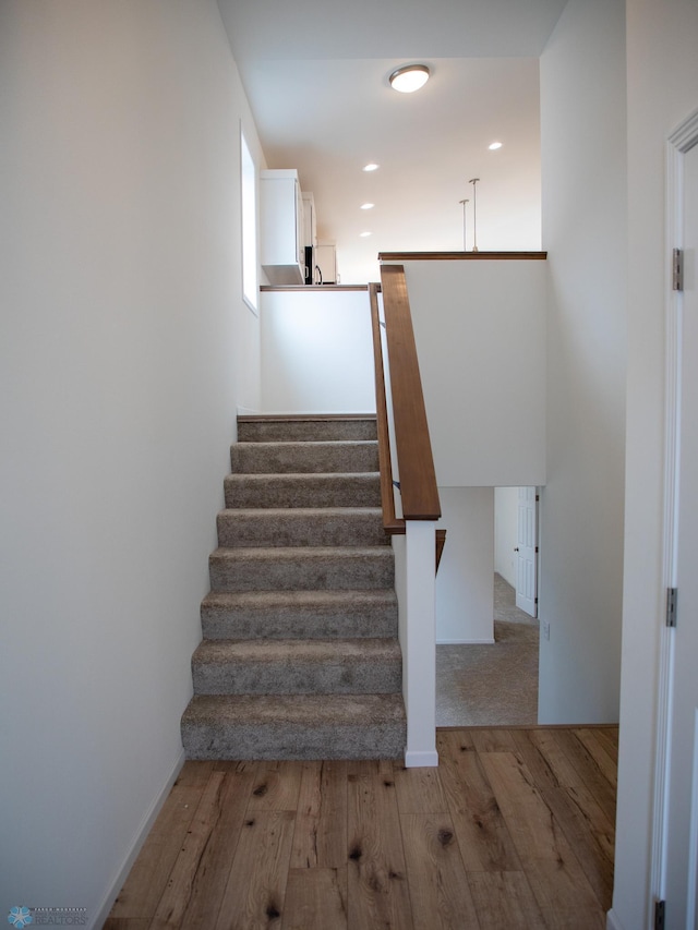 7891 Lost River Rd, Horace, ND 58047 - stairs with wood finished floors
