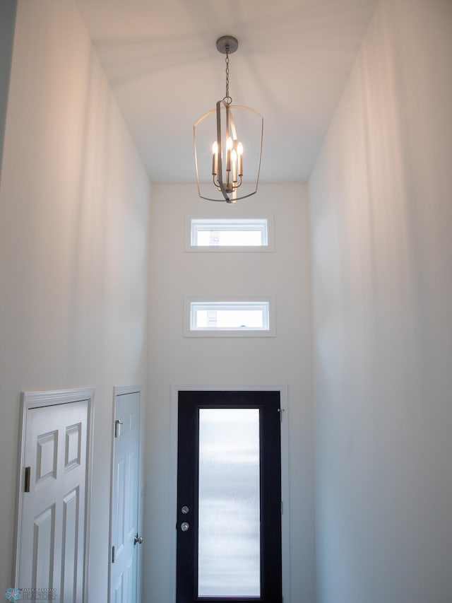 7891 Lost River Rd, Horace, ND 58047 - doorway featuring a chandelier and a towering ceiling