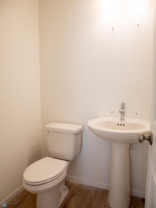 7891 Lost River Rd, Horace, ND 58047 - half bathroom with wood finished floors