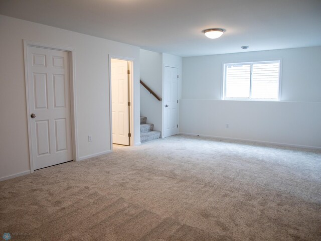 7891 Lost River Rd, Horace, ND 58047 - carpeted spare room with stairway and baseboards