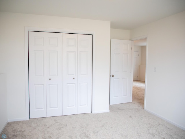 7891 Lost River Rd, Horace, ND 58047 - unfurnished bedroom featuring carpet flooring and a closet