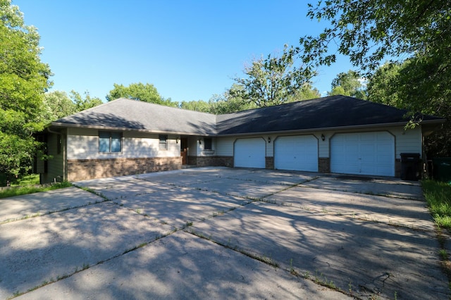 1012 Maple Ridge Ct NW, Northern Twp, MN 56601 - ranch-style home featuring an attached garage, driveway, and brick siding