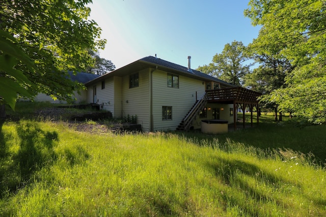 1012 Maple Ridge Ct NW, Northern Twp, MN 56601 - view of property exterior with a wooden deck and stairway