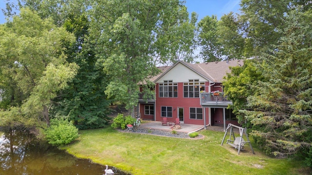 6961 Meadow Ct, Centerville, MN 55038 - rear view of property with a patio, a yard, and a wooden deck