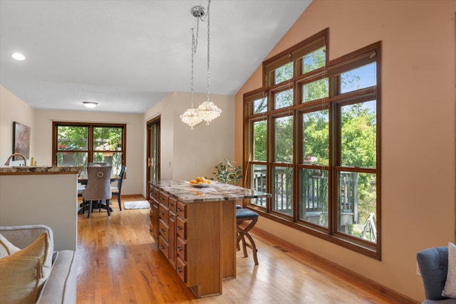 6961 Meadow Ct, Centerville, MN 55038 - dining area with light wood-style flooring, a chandelier, recessed lighting, and lofted ceiling