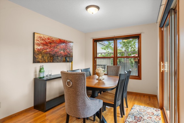 6961 Meadow Ct, Centerville, MN 55038 - dining space featuring light wood finished floors and baseboards