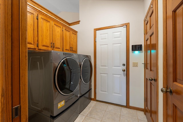 6961 Meadow Ct, Centerville, MN 55038 - laundry room with cabinet space, washing machine and dryer, and light tile patterned flooring