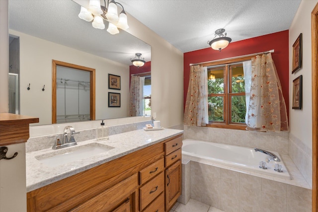6961 Meadow Ct, Centerville, MN 55038 - bathroom featuring vanity, a garden tub, a chandelier, a textured ceiling, and tile patterned floors