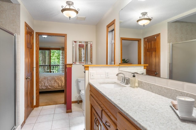 6961 Meadow Ct, Centerville, MN 55038 - ensuite bathroom featuring a shower stall, tile patterned floors, and vanity