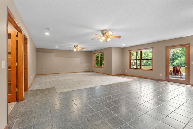 6961 Meadow Ct, Centerville, MN 55038 - empty room featuring ceiling fan, recessed lighting, tile patterned flooring, and a textured ceiling