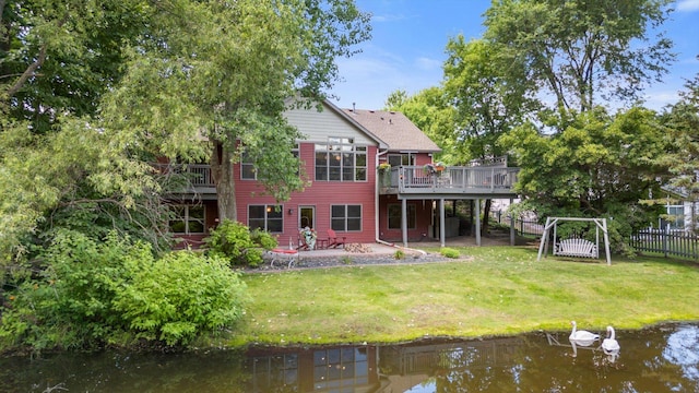 6961 Meadow Ct, Centerville, MN 55038 - rear view of property with a deck with water view and a patio