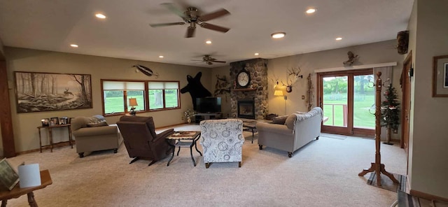 2473 Marshall St, Albert Lea, MN 56007 - living area with light carpet, recessed lighting, a ceiling fan, and a stone fireplace