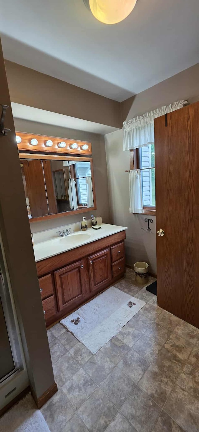 2473 Marshall St, Albert Lea, MN 56007 - bathroom featuring vanity and stone finish flooring
