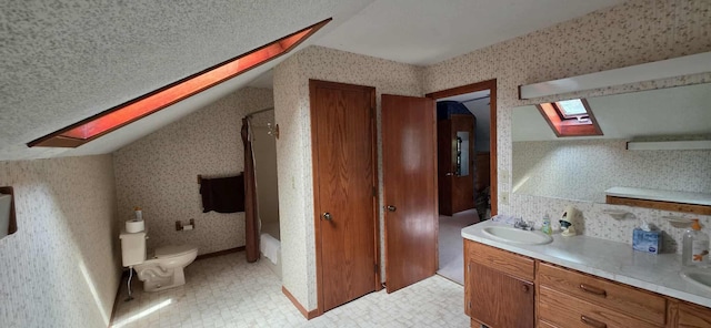 2473 Marshall St, Albert Lea, MN 56007 - full bath featuring a skylight, lofted ceiling, wallpapered walls, double vanity, and washtub / shower combination