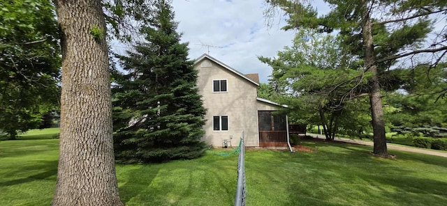 2473 Marshall St, Albert Lea, MN 56007 - view of side of home with a sunroom and a lawn