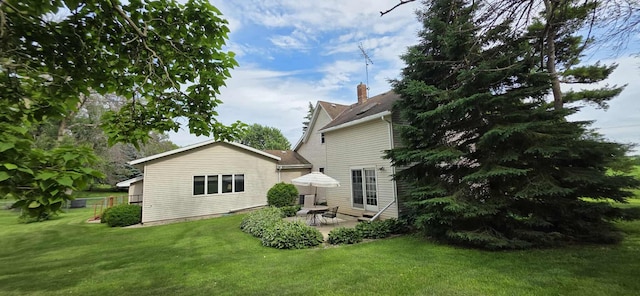 2473 Marshall St, Albert Lea, MN 56007 - back of property with a patio and a lawn