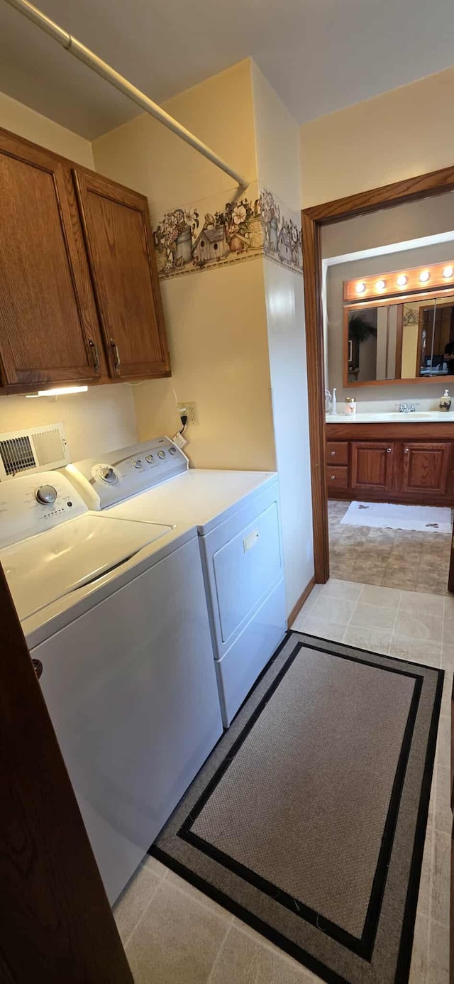 2473 Marshall St, Albert Lea, MN 56007 - washroom featuring washer and clothes dryer and cabinet space