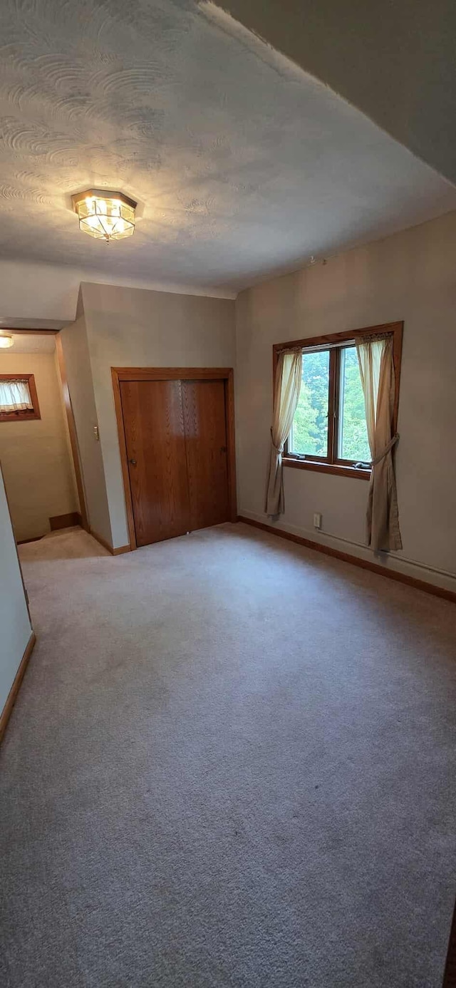 2473 Marshall St, Albert Lea, MN 56007 - empty room with baseboards and light carpet