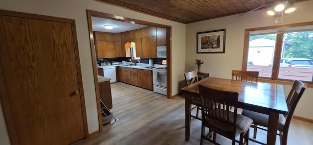2473 Marshall St, Albert Lea, MN 56007 - kitchen featuring white appliances, brown cabinetry, wooden ceiling, backsplash, and light countertops