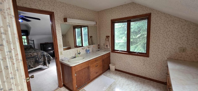 2473 Marshall St, Albert Lea, MN 56007 - full bathroom featuring ensuite bathroom, double vanity, wallpapered walls, vaulted ceiling, and ceiling fan