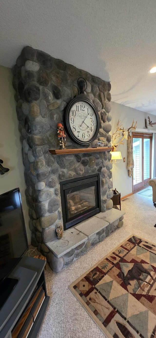 2473 Marshall St, Albert Lea, MN 56007 - detailed view of carpet flooring, a fireplace, and a textured ceiling