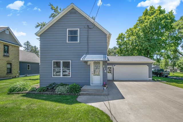 216 1st St SW, Melrose, MN 56352 - traditional home with a front yard, an attached garage, and driveway