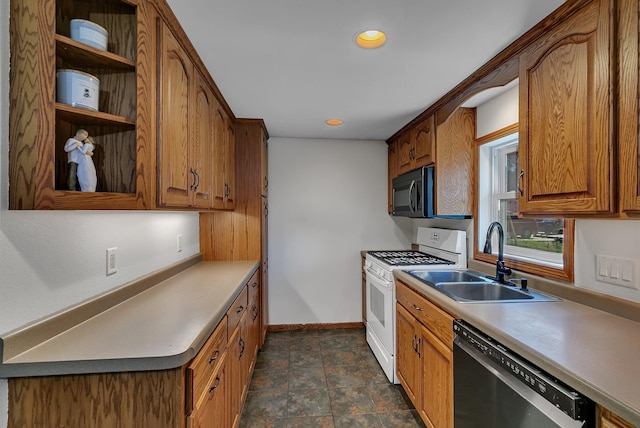 216 1st St SW, Melrose, MN 56352 - kitchen with dishwashing machine, white gas range oven, black microwave, brown cabinets, and recessed lighting