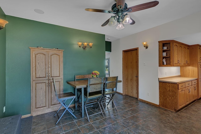 216 1st St SW, Melrose, MN 56352 - dining area featuring baseboards and a ceiling fan