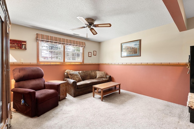1602 19th Ave SW, Austin, MN 55912 - carpeted living area featuring ceiling fan and a textured ceiling
