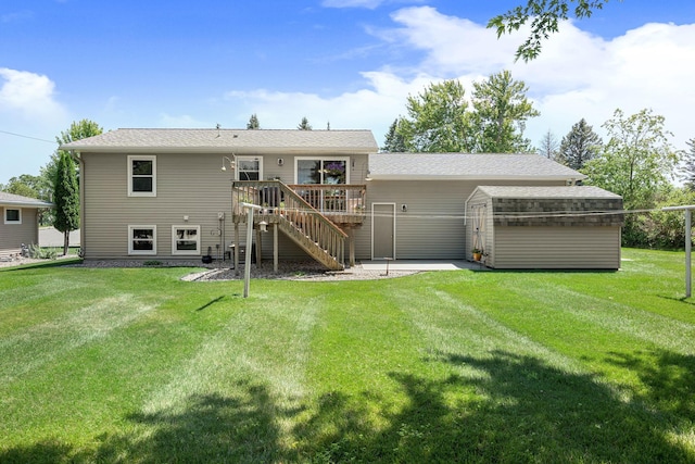 1602 19th Ave SW, Austin, MN 55912 - back of property featuring stairway, a wooden deck, a storage unit, a yard, and a patio area