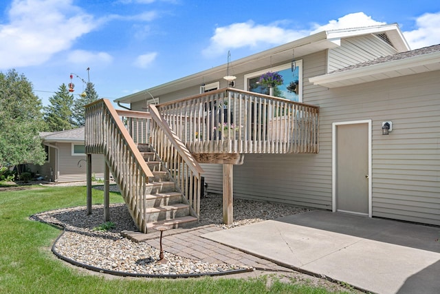 1602 19th Ave SW, Austin, MN 55912 - back of house with a deck, stairs, a lawn, and a patio area
