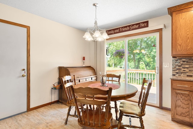 1602 19th Ave SW, Austin, MN 55912 - dining space featuring light wood-type flooring and a chandelier