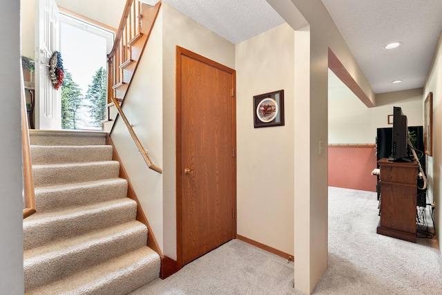 1602 19th Ave SW, Austin, MN 55912 - stairway with carpet flooring, recessed lighting, and a textured ceiling