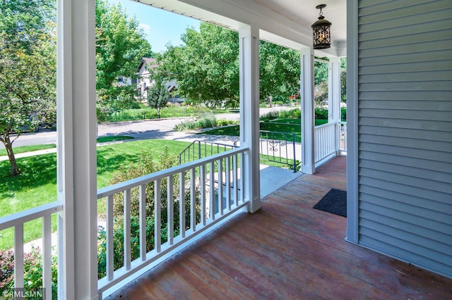 4709 Colfax Ave S, Minneapolis, MN 55419 - wooden porch featuring a yard