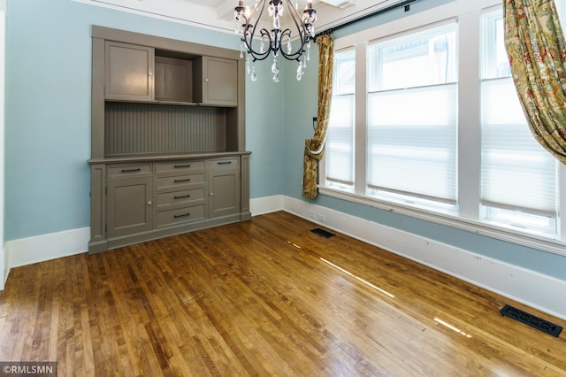 4709 Colfax Ave S, Minneapolis, MN 55419 - unfurnished dining area featuring a chandelier and dark wood-style floors