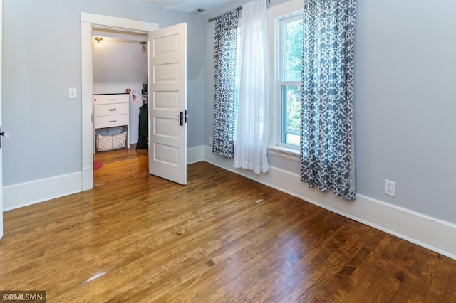 4709 Colfax Ave S, Minneapolis, MN 55419 - unfurnished bedroom featuring baseboards and wood finished floors
