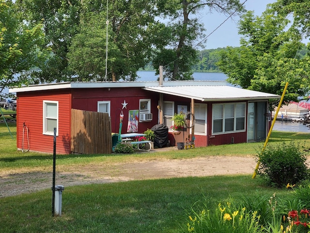 29501 Maplewood Rd Longshore, Unit Longshore, Callaway, MN 56521 - view of front of home with a front yard, a metal roof, and cooling unit