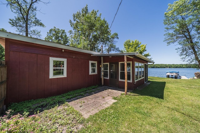 29501 Maplewood Rd Longshore, Unit Longshore, Callaway, MN 56521 - back of house featuring a lawn, a water view, and a patio area